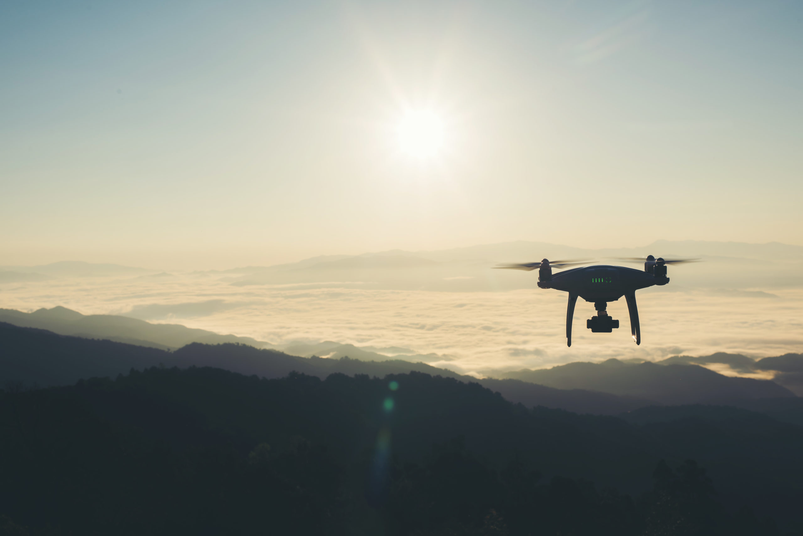 Drone flying in the sunset take a photo and video record